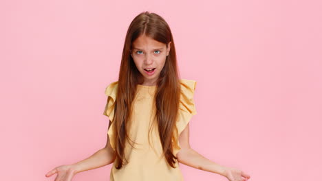 Child girl kid raising eyebrows in surprise showing gesture what why with puzzled emotional reaction
