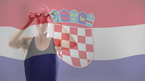 animation of flag of croatia over caucasian female swimmer