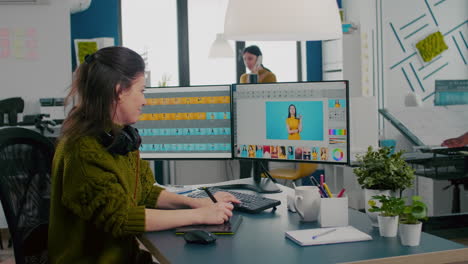 Retoucher-woman-working-on-computer-with-two-monitors-and-stylus-pencil