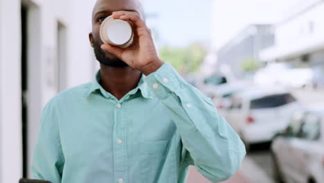 Black-man,-coffee-and-walking-with-a-phone-in-city