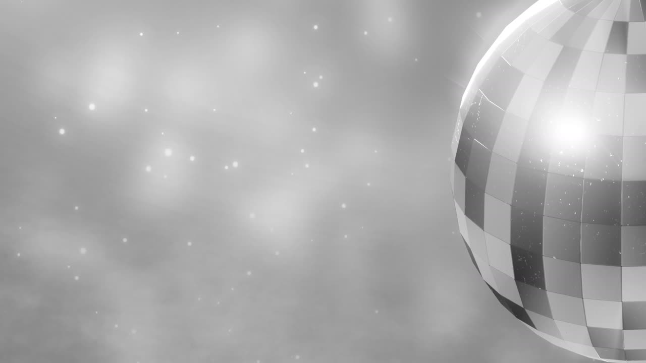 Animation einer sich drehenden Spiegel-Discokugel über Lichtflecken auf grauem Hintergrund