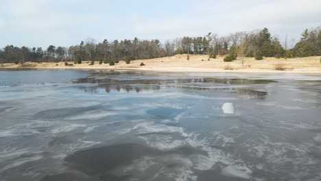 dune harbor, low pan over melting ice shelf