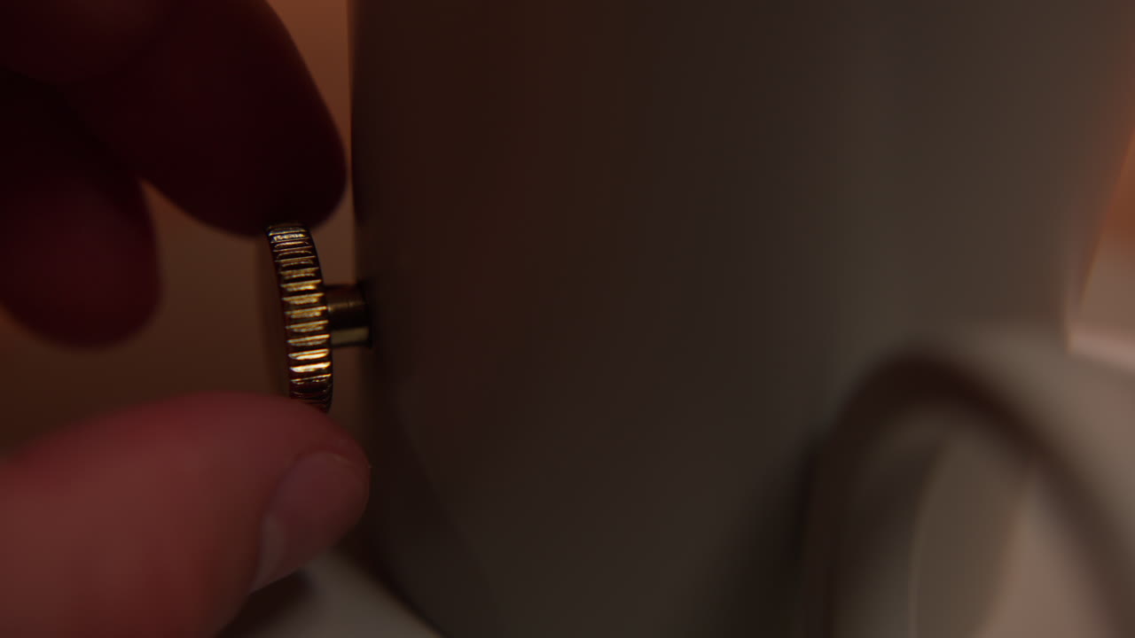 control de la perilla, encendido de la lámpara de giro del dedo de primer plano