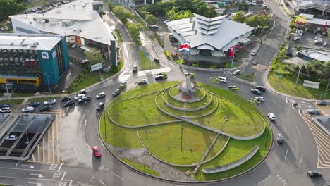 san jose, costa rica - february 28, 2023 - the roundabout called rotonda de la bandera (the flag) in san pedro. aerial drone view, fast rotating tracking movement, daylight.