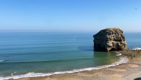 serene coastal landscape with cliffs and ocean waves