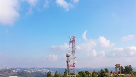 communication tower over cityscape