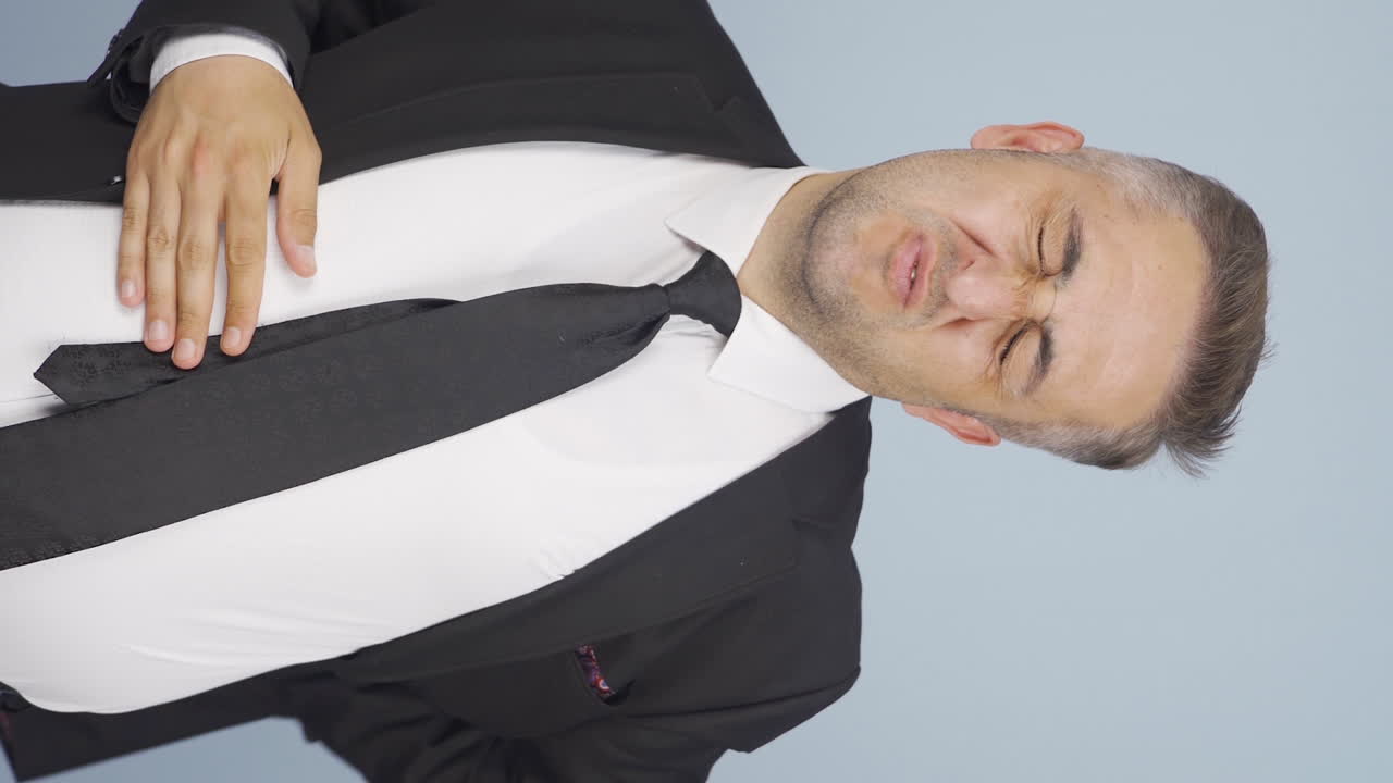 사업가의 수직 영상 가려움증. 가려움증.