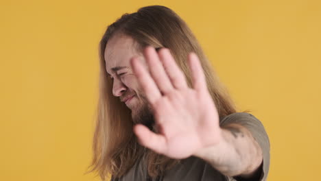 caucasian young man scared in front of the camera.