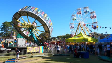 people enjoying rides at a lively carnival