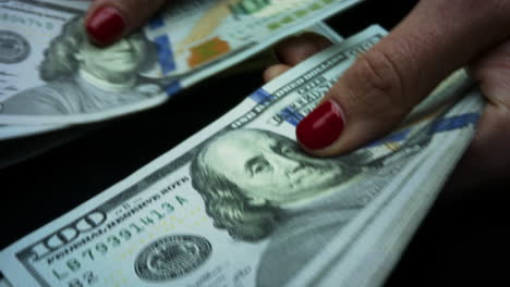 woman counting american dollars cash money.