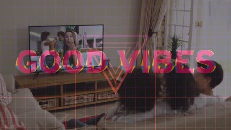 animation of good vibes text over african american family having video call with friends