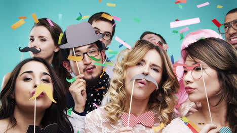 multi racial group of funny people celebrating slow motion party photo booth