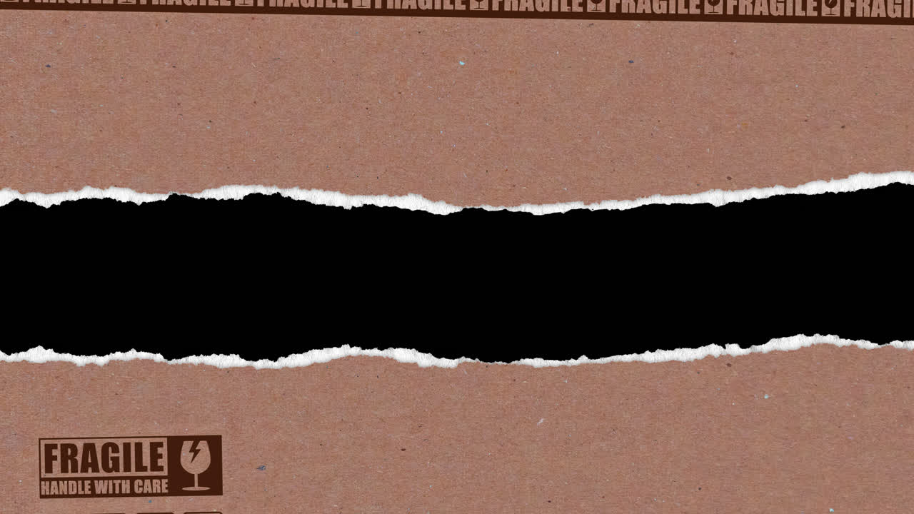 Ripped Cardboard with Fragile Label Revealing Black Background
