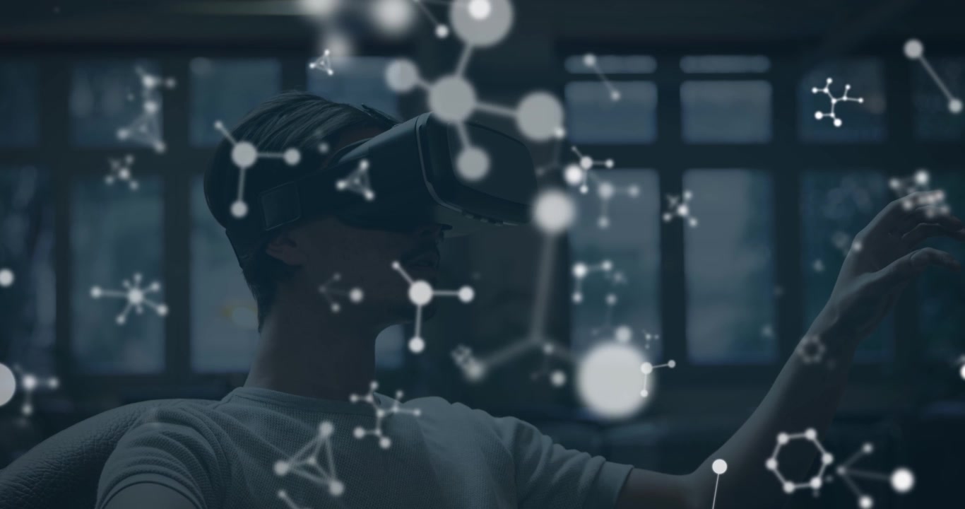 Animation of shapes over caucasian man using vr headset