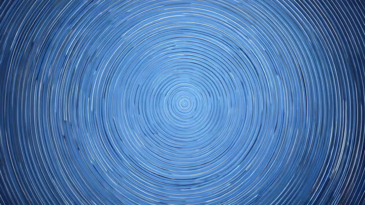 Starting playback causing blue concentric rings pattern looping on digital screen, showing symmetry