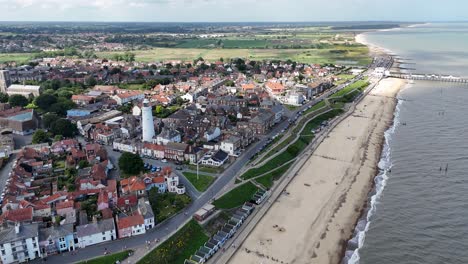 aerial view of a coastal town with a lighthouse