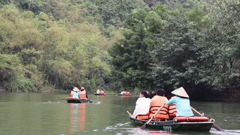 tourists enjoying a guided boat tour on a river