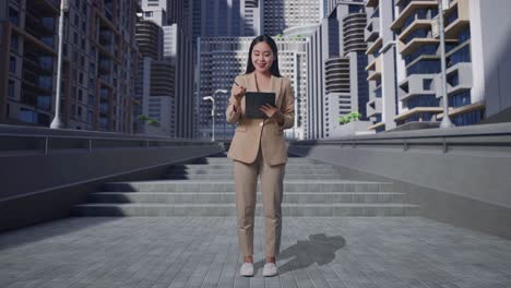 businesswoman working on tablet in a city
