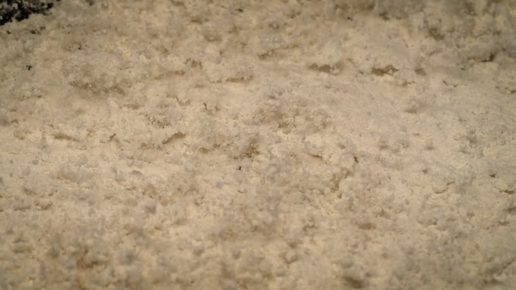Protein Powder bouncing on black Surface Super Slow Motion Bodybuilding, fitness and gym lifestyle
