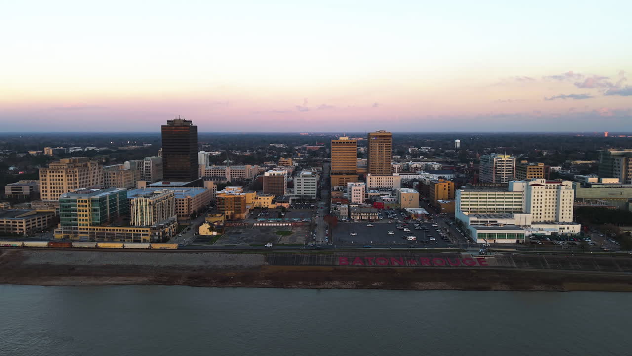 Establishing drone shot approaching the Baton Rouge skyline, dusk in LA, USA