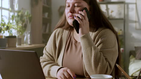 woman working with laptop at home