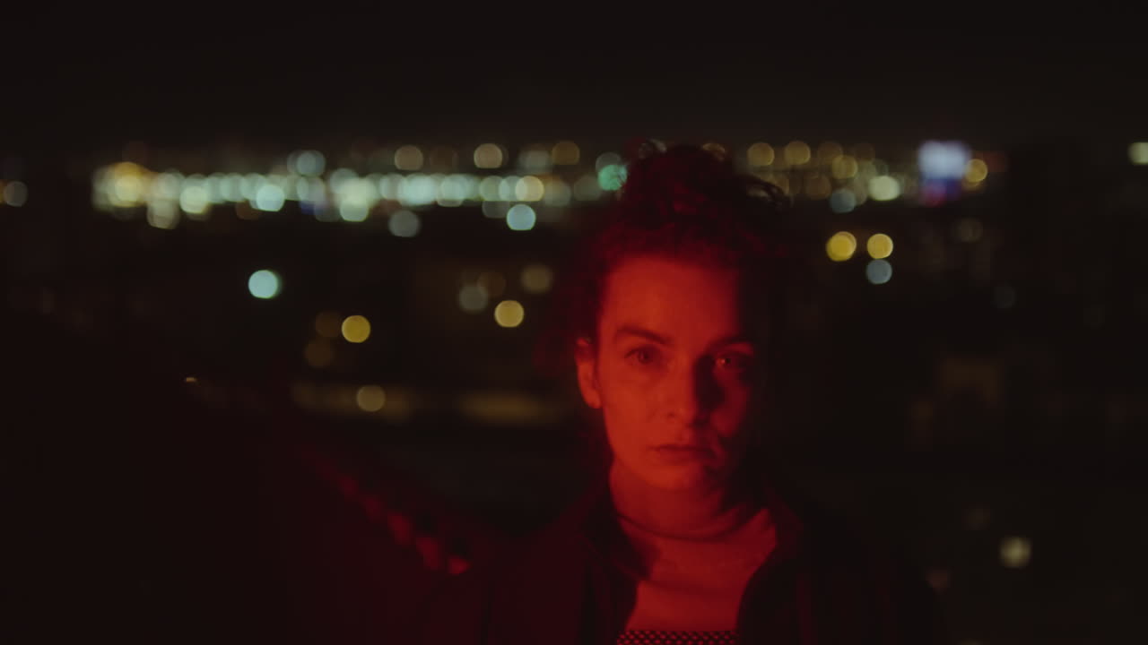 Portrait of Woman in Red Neon Light at Night