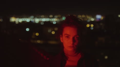 portrait of woman in red neon light at night