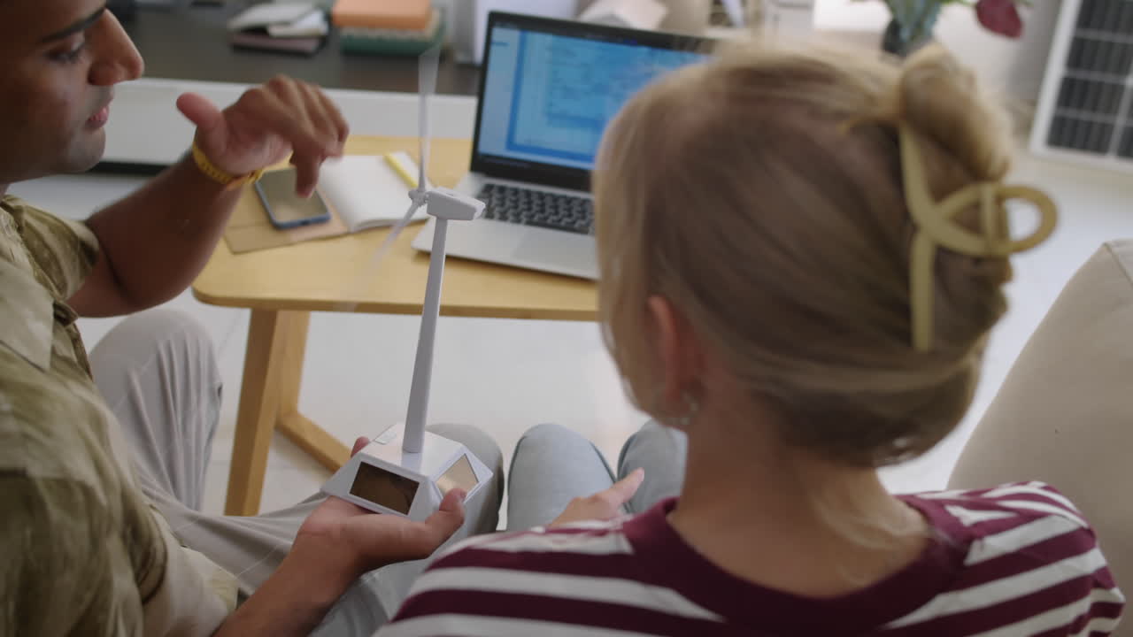 Couple of Environmental Specialists Talking about Innovations in Wind Turbines