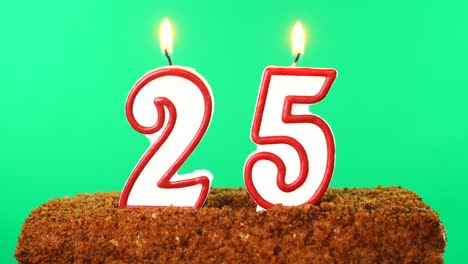 cake with the number 25 lighted candle. chroma key. green screen. isolated