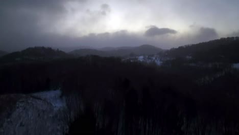 aerial of clouds and snowfall near boone nc, north carolina