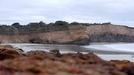 sandstone cliff face of an australian beach