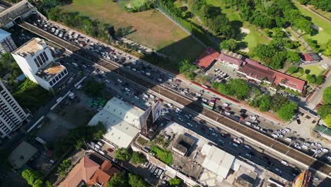 slow traffic jam over edsa highway near greenhills city in san juan, metro manila, philippines. aerial drone shot