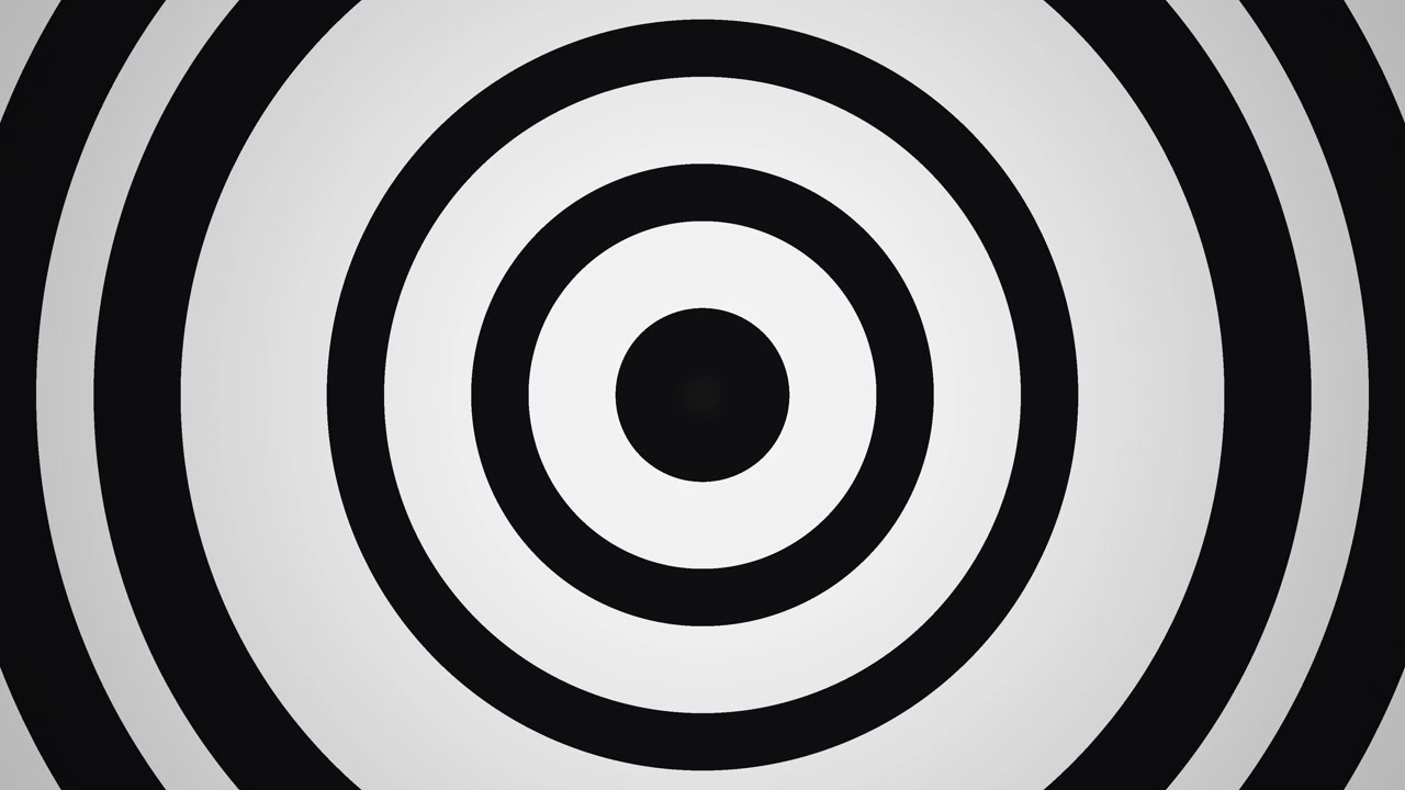Concentric circles in black and white spin rapidly, drawing the eye towards the center. The design creates a sense of movement and , engaging the viewer s attention