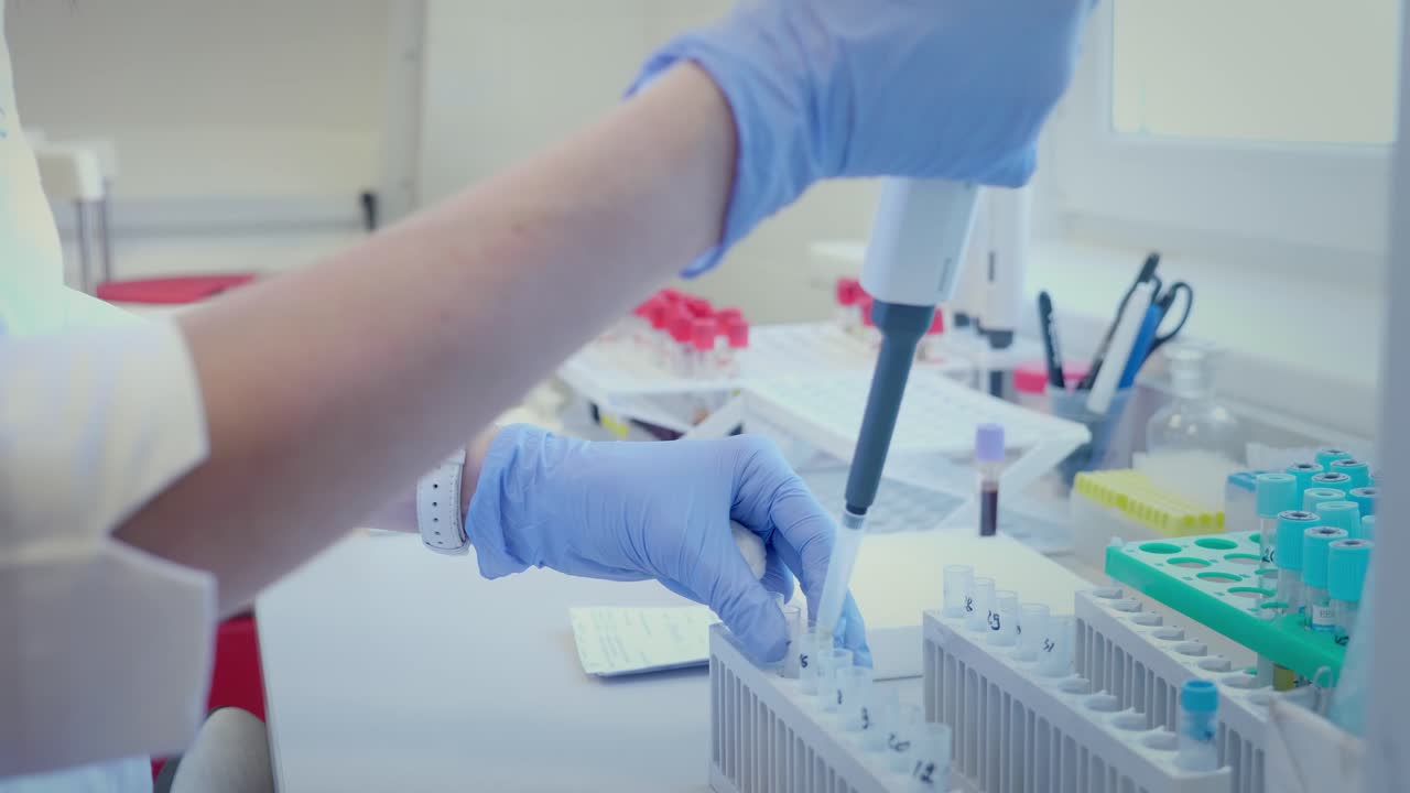 Lab Technician Performing Blood Tests