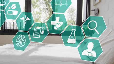 animation of medical icons over empty room with bed in hospital