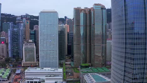 the hong kong observation wheel and ifc skyscrapers at the new central harbourfront, central district. hong kong on june 15 2019.