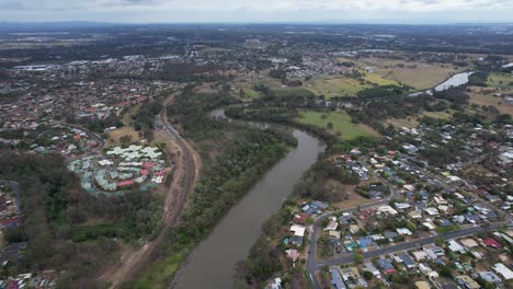 flying above logan river and riverfront suburbs in queensland, australia