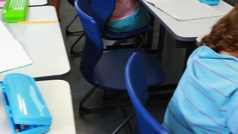 kids drawing in classroom