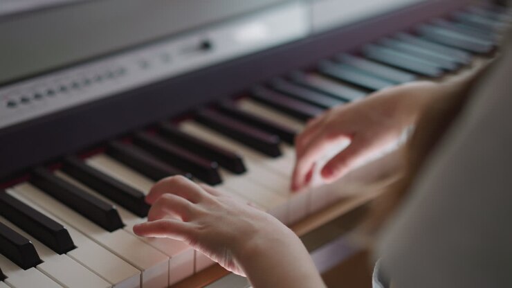 Schoolgirl with absolute pitch plays synthesizer smoothly
