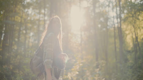 Hiker-Walking-In-Forest-During-Sunny-Day