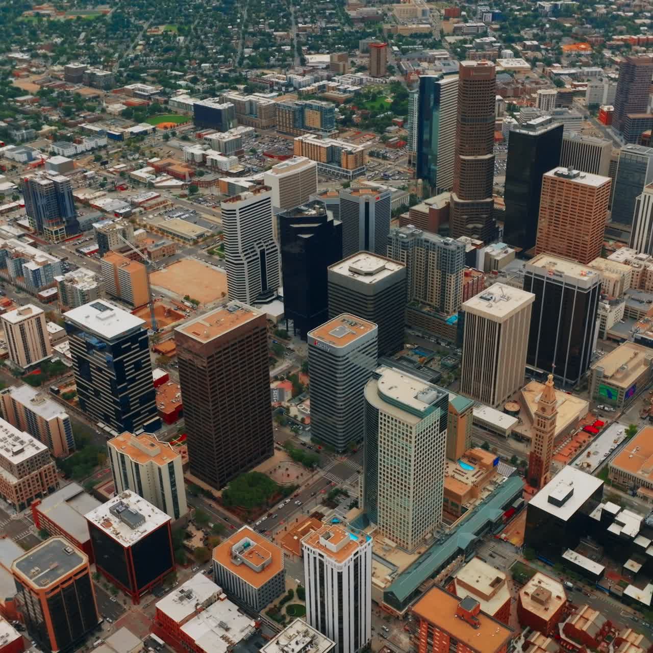 Descending over the financial downtown of Denver, Colorado, USA. Bird's eye perspective on the wonderful skyscrapers at daytime