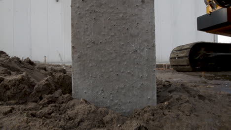 driving a pile into the ground on a construction site