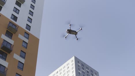 drone flying over apartment buildings