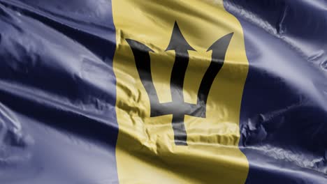 la bandera de barbados se agita lentamente en el bucle del viento. el estandarte de barbados se balancea suavemente en la brisa. fondo de relleno completo. bucle de 20 segundos.