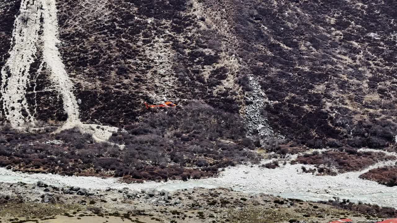 A helicopter soars above the Everest Base Camp region, providing essential transport and rescue services across Nepal’s rugged Himalayan terrain.