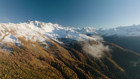 Autumn-Forest-On-Snowy-Mountain-In-Mont-Noble,-Valais,-Switzerland