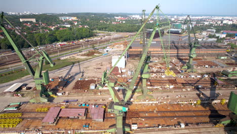 aerial drone of construction site, cranes, urban development, crane