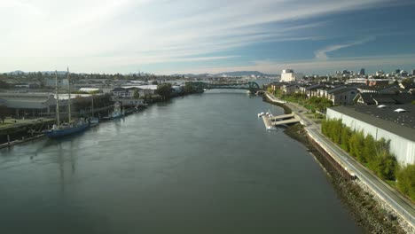 the park street bridge frames the tidal canal from above, revealing a mix of boats, docks, and cityscape beyond.