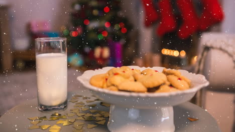 la nieve que cae con el regalo de navidad para santa con galletas y leche