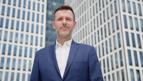 Caucasian-business-man-straightens-his-suit-outdoors,-portrait-shot